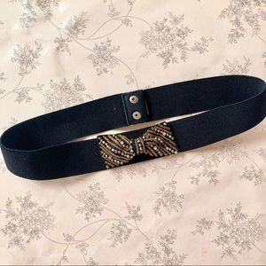 belt with metallic beaded bow